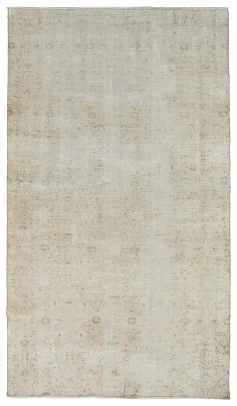 Full top view of the 5'1" x 8'10" beige faded floral Anatolian vintage rug on a white background.
