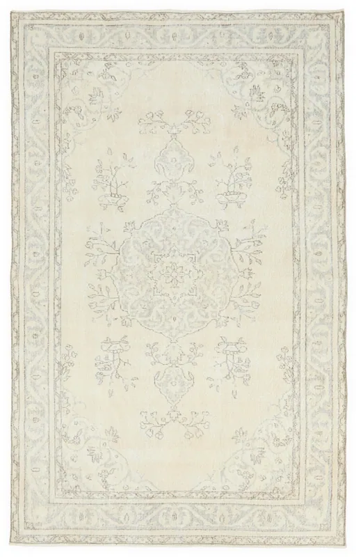 Full top view of the 5'3" x 8'5" ivory and gray vintage Anatolian rug on a white background