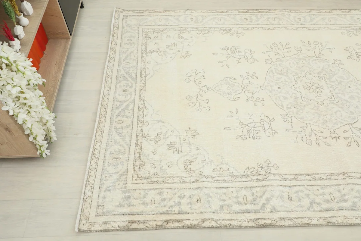 Overhead angle shot of the rug's corner, showing the decorative border and medallion details