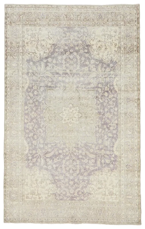 Full overhead view of the 6'5" x 10'5" vintage Anatolian rug on a white background, showcasing its faded purple medallion.