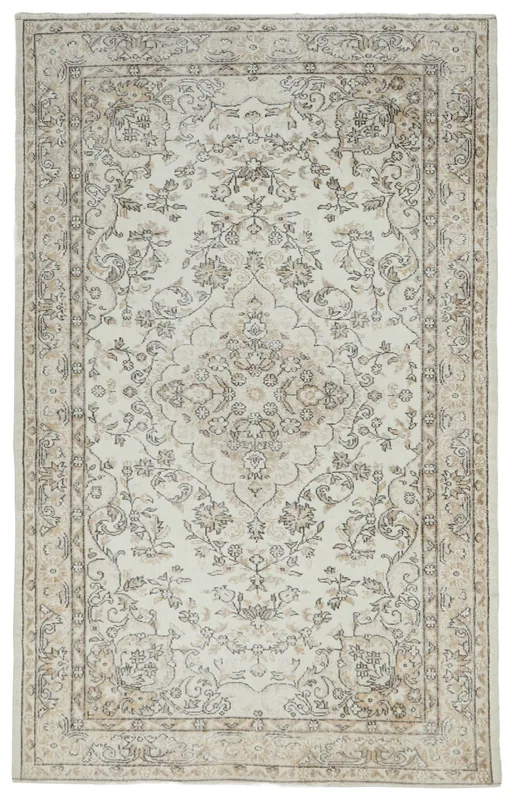 Full top view of the 6x9 ivory and beige vintage Anatolian floral medallion rug on a white background.