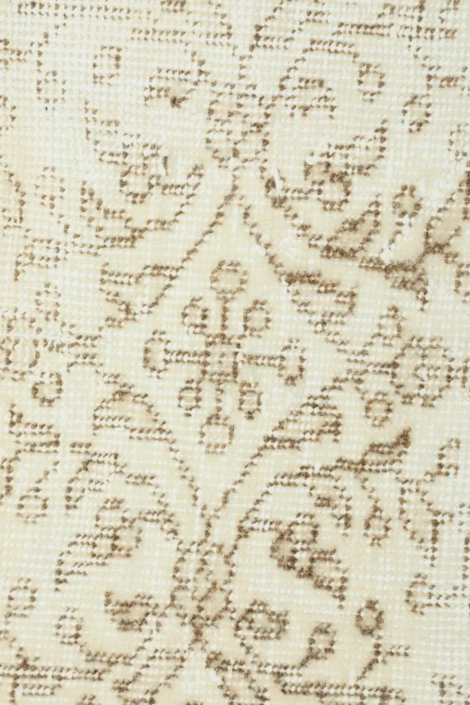 Macro detail of the intricate floral and geometric patterns and low pile texture