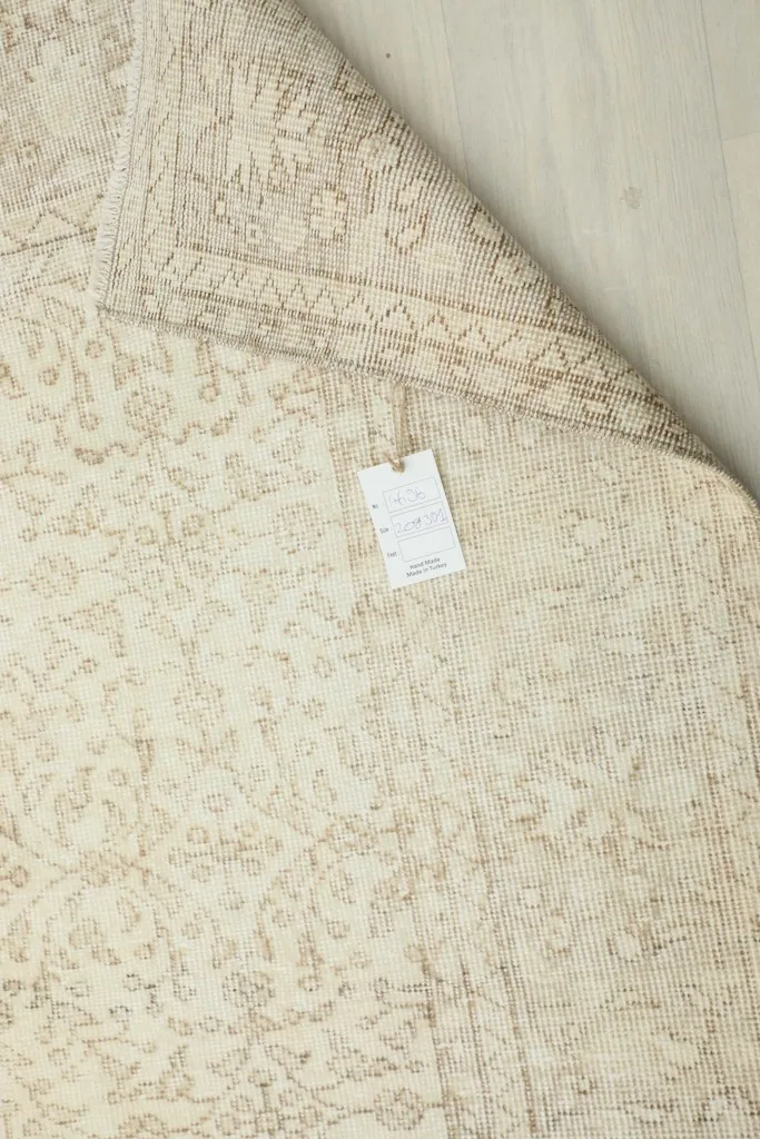Close-up of the rug's label attached to the back, showing product information