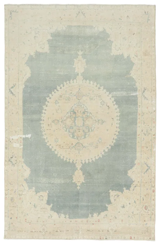 Full overhead view of the 5'4" x 9'7" vintage Anatolian rug with blue field and cream border on a white background.