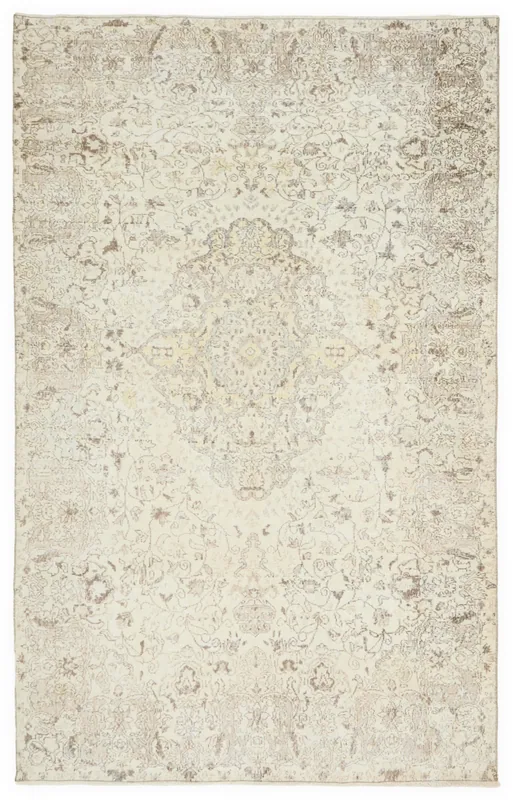 Full top view of the 6'8" x 10'6" ivory and beige vintage Anatolian area rug.