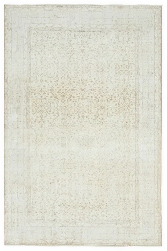 Full top view of the 5'4" x 8'6" cream and tan vintage Anatolian wool rug