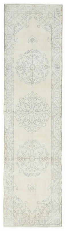 Full overhead view of the 2'8" x 10'6" vintage Anatolian runner with ivory and blue medallion pattern.