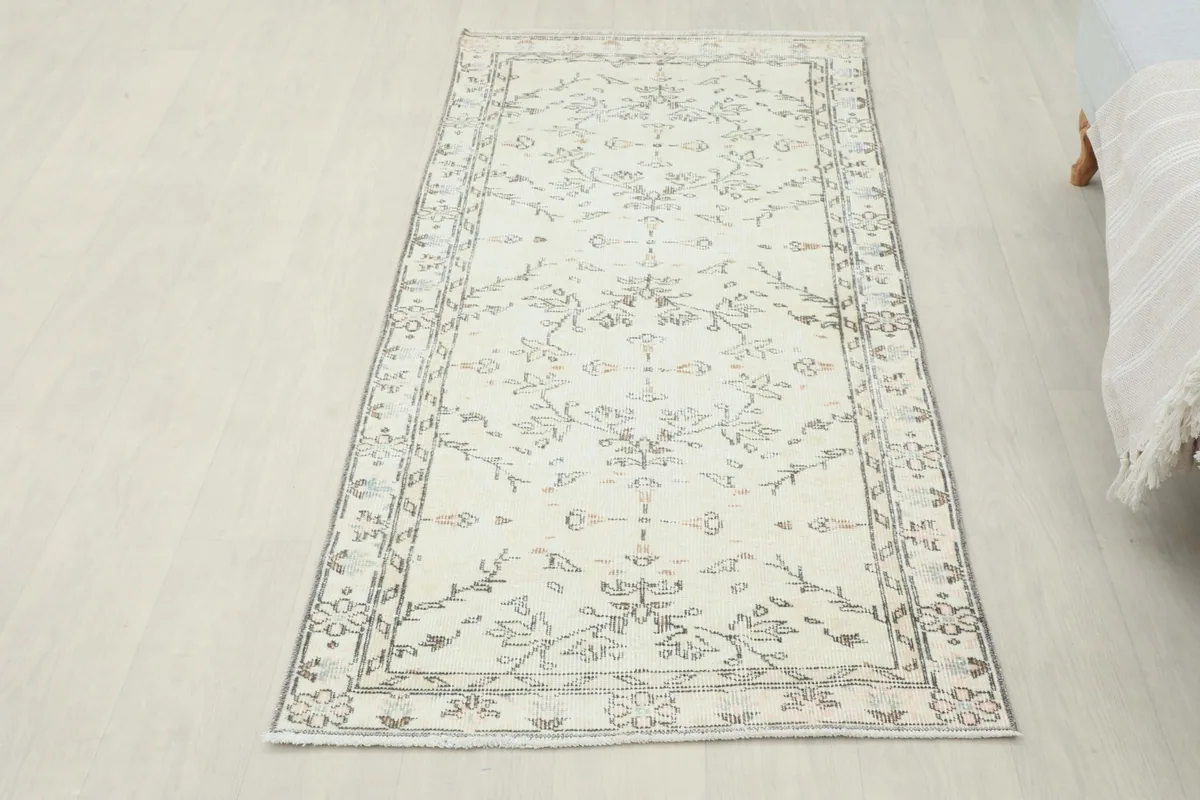 Full overhead view of the runner rug, displaying its dimensions and design on a light floor