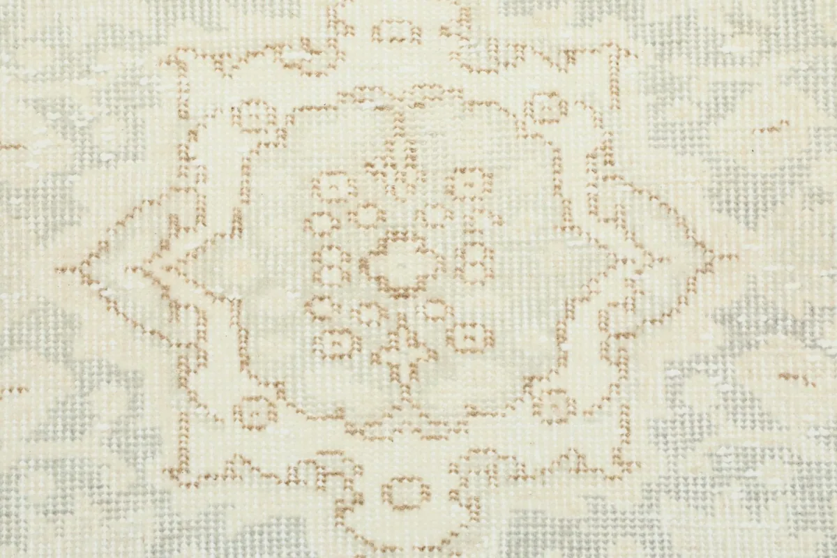 Close-up of the low wool pile, showing the detailed knotting and subtle color variations