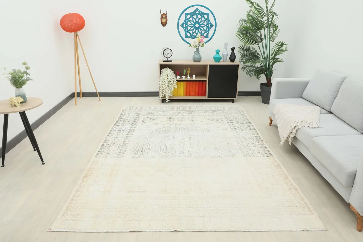 Wide shot of the ivory geometric rug in a contemporary living room setting