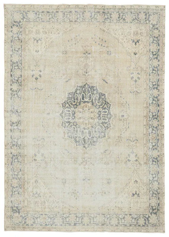Full top view of the beige and gray vintage Anatolian area rug with central medallion