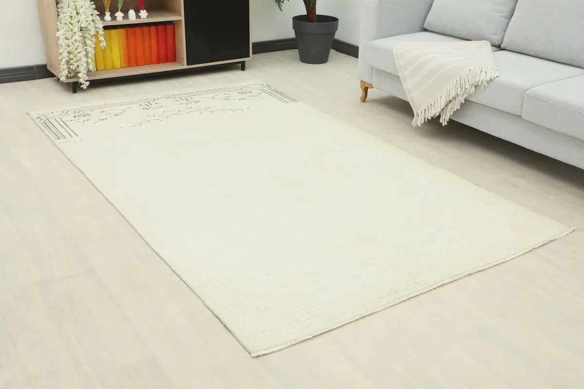 Angle view of the ivory rug in a living room, highlighting its placement in the space.