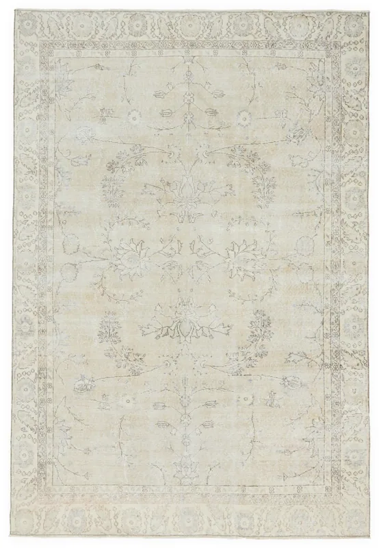 Full top view of the 6'7" x 9'8" ivory vintage Anatolian rug with subtle floral patterns.