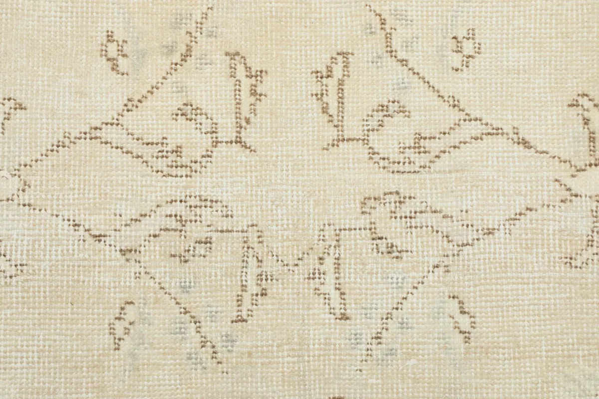 Close-up detail showing the hand-knotted wool pile and subtle color variations in the pattern.
