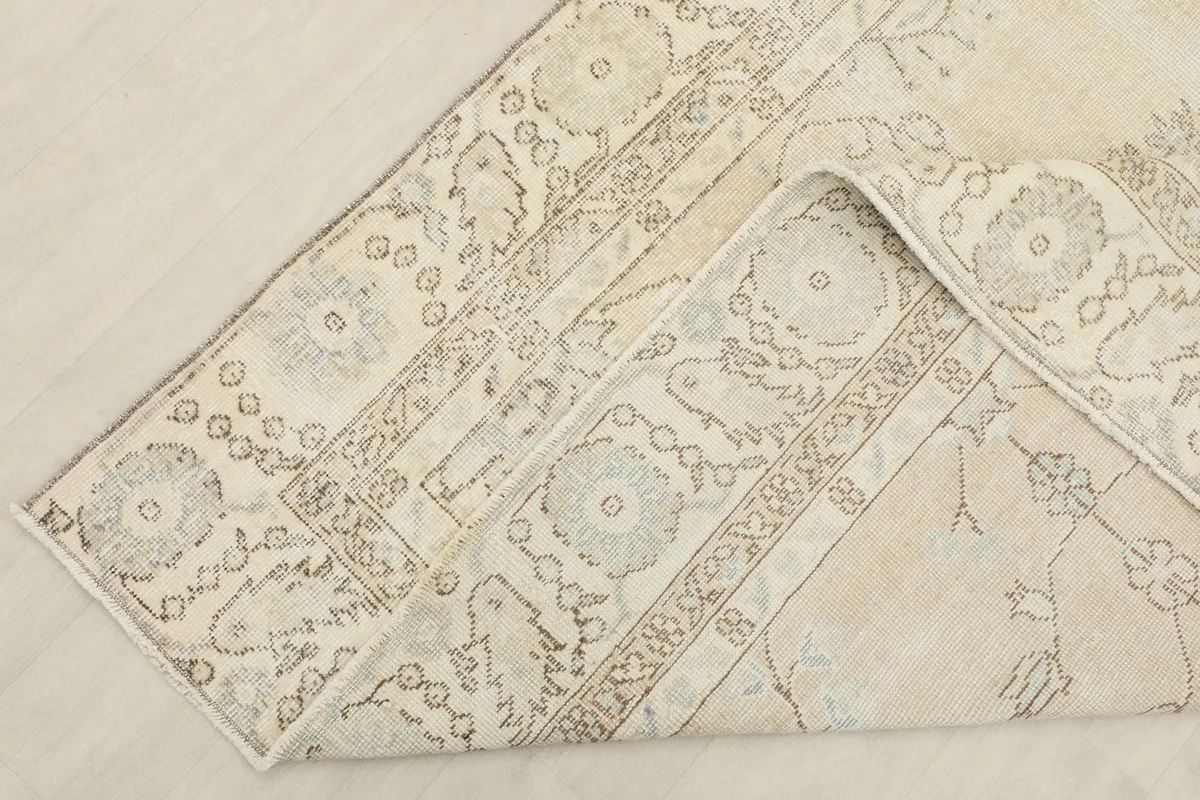 Detailed view of the back of the rug, showing the hand-knotted construction and foundation.