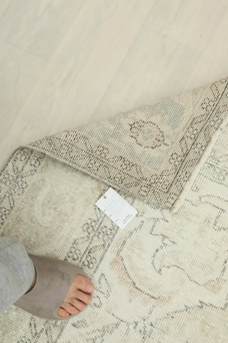 Underside of the Cream Gray Medallion Rug showing the hand-knotted construction.