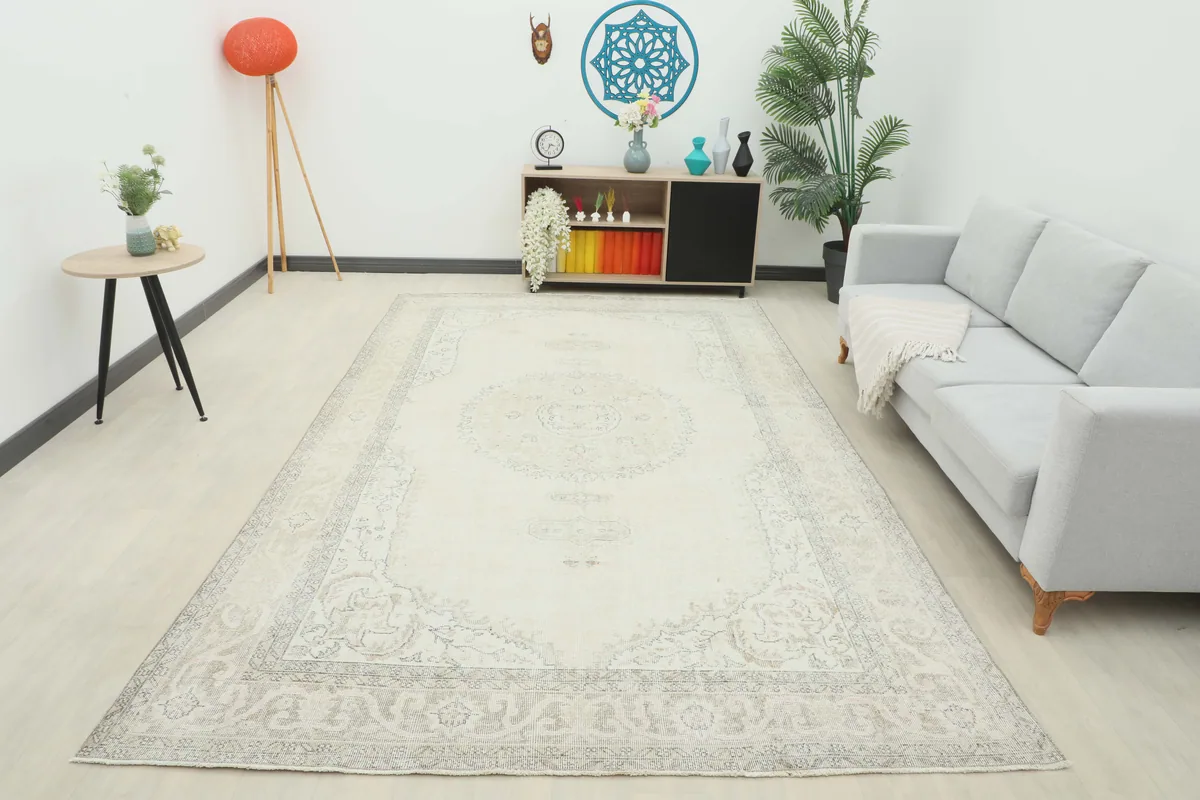 Full room view of the Cream Gray Medallion Rug, showcasing its scale and color.