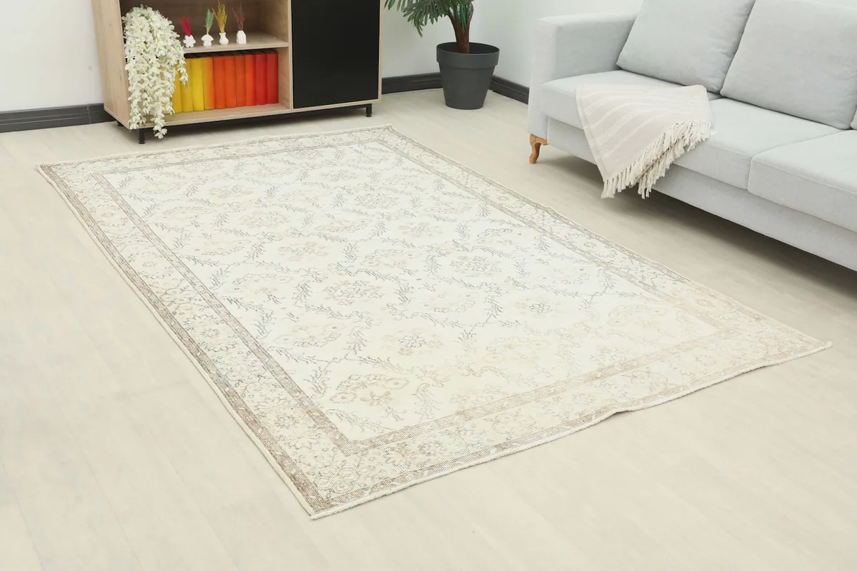 Angle view of the 6x9 vintage Anatolian rug in a room, showing its placement relative to furniture.