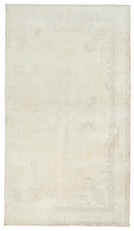 Full overhead view of the 5'7" x 9'9" ivory vintage Anatolian rug on a white background.