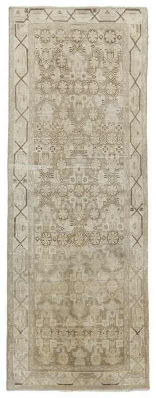 Full overhead view of the 3'3" x 9'2" tan runner rug with geometric and floral patterns.