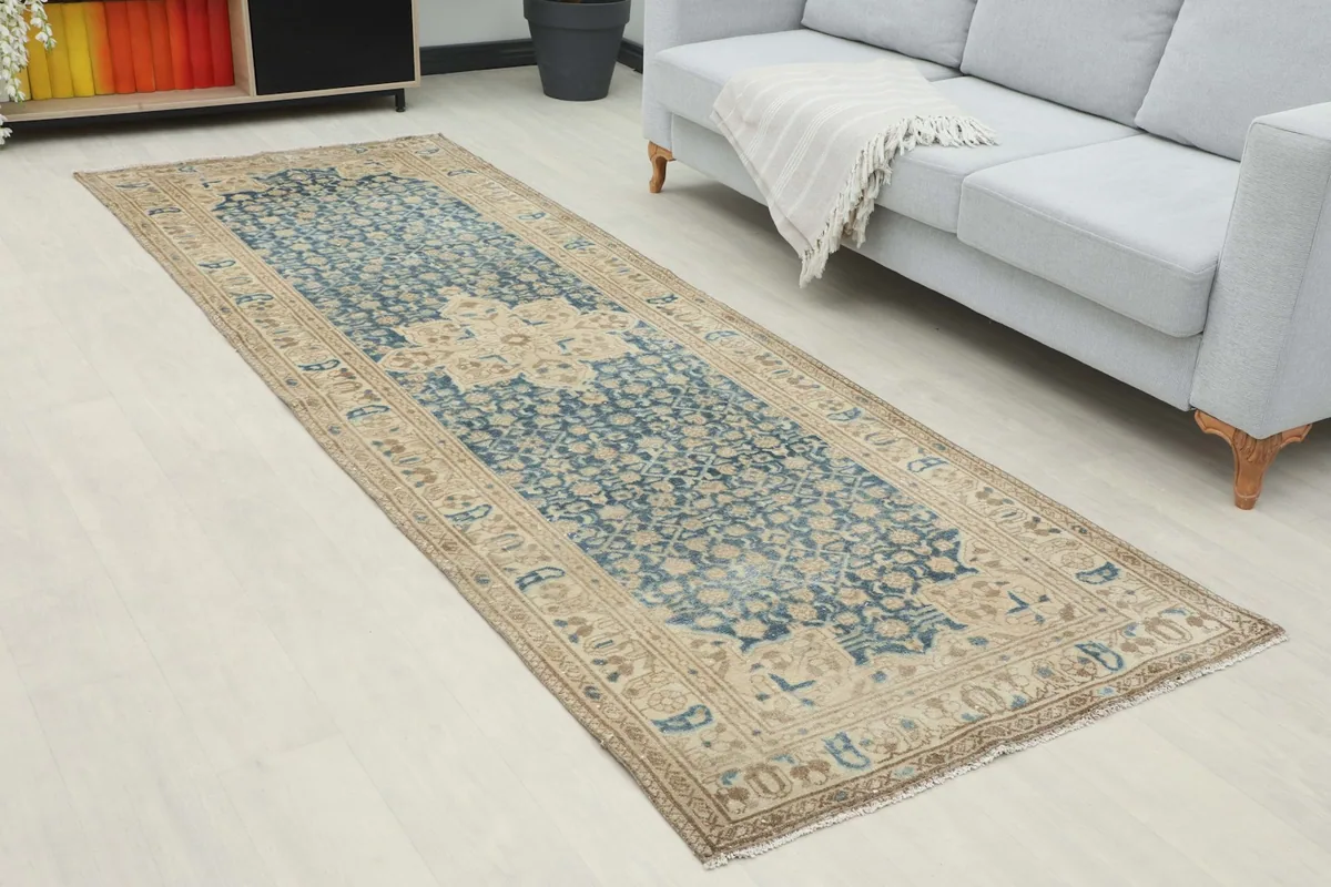 Close-up view of the runner rug in a room, showing its length and pattern