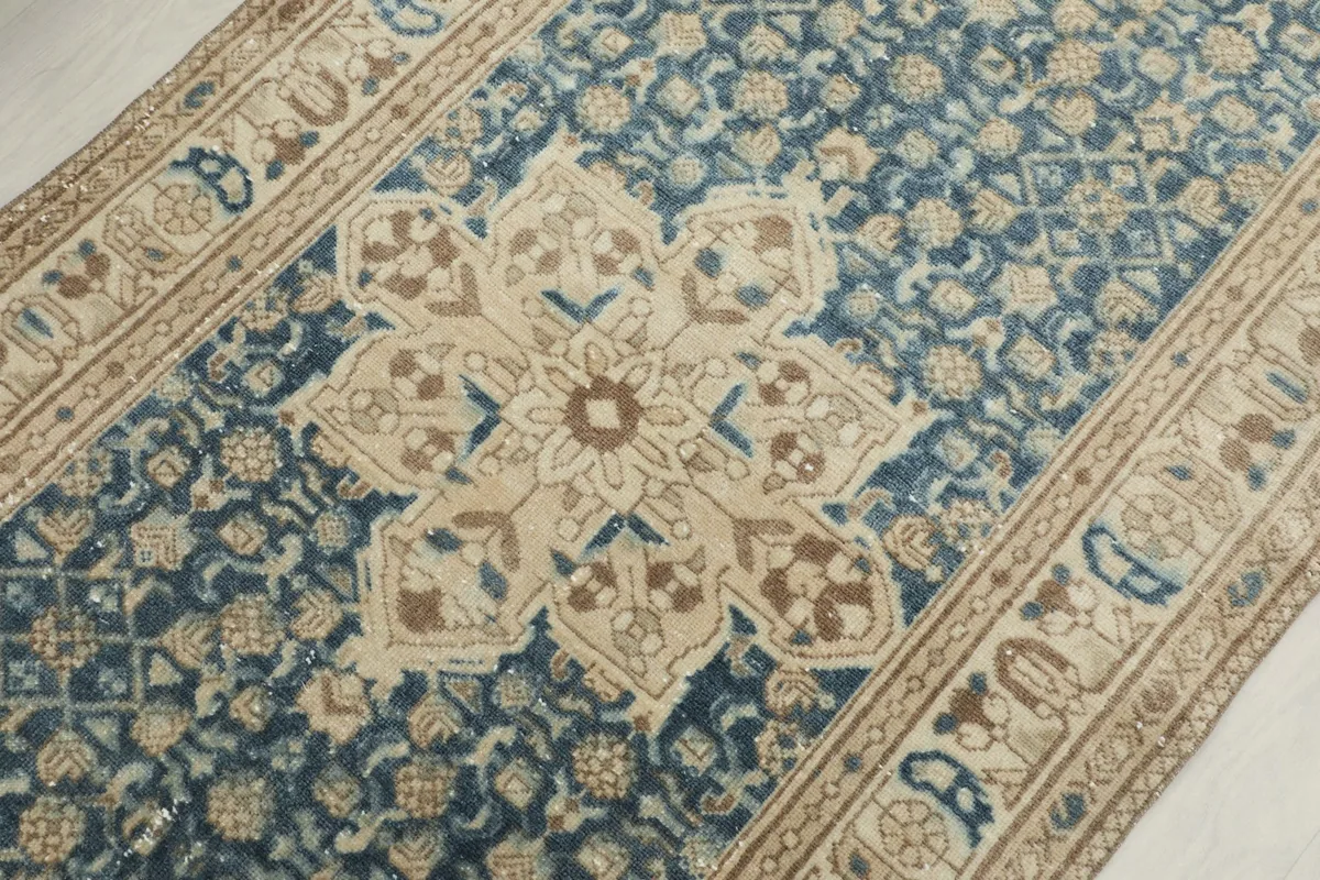 Detailed angled view of the central medallion and surrounding blue field