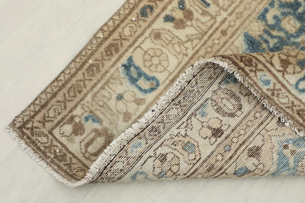 View showing the back of the rug and the hand-knotted construction