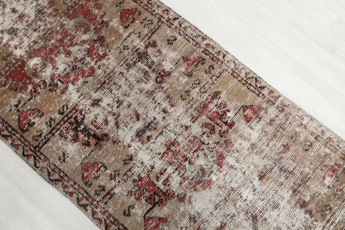 Overhead angle shot highlighting the faded colors and unique pattern of the vintage runner.