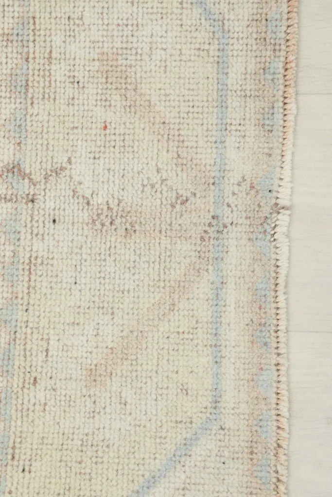 Detailed view of the side border and edge finishing of the hand-knotted Anatolian rug