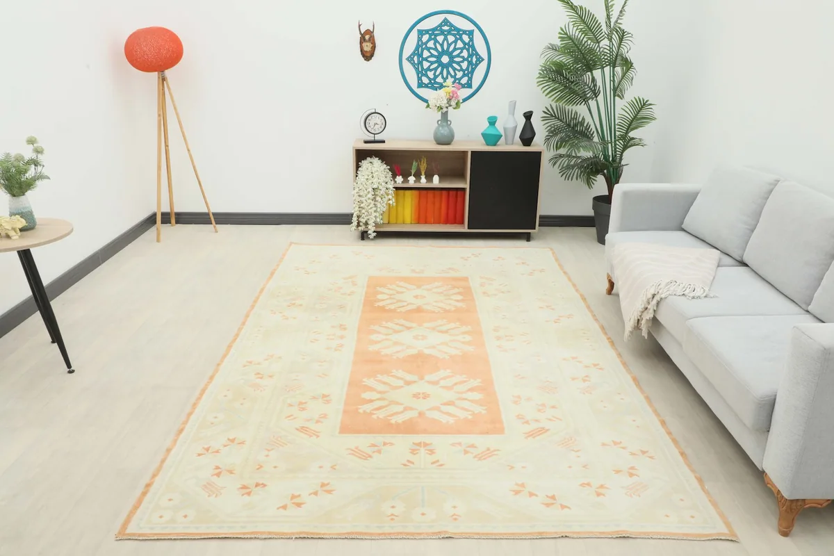 Full room view of the 6'5" x 9'8" vintage rug, providing a sense of its overall presence.