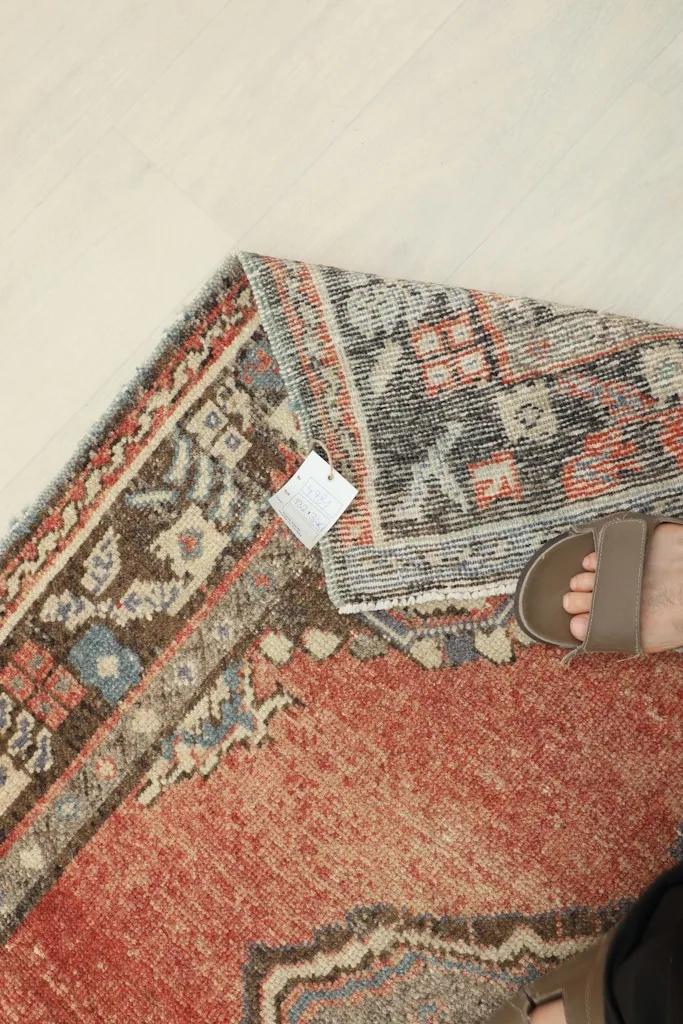 Detail of the rug's back, showing the tight hand-knotting and the texture of the wool.