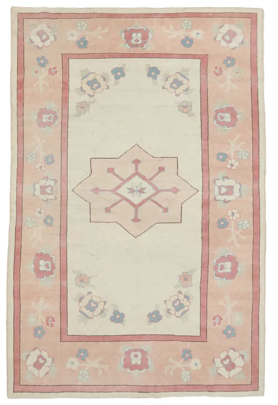 Full top view of the ivory and rose vintage Anatolian rug with geometric and floral patterns