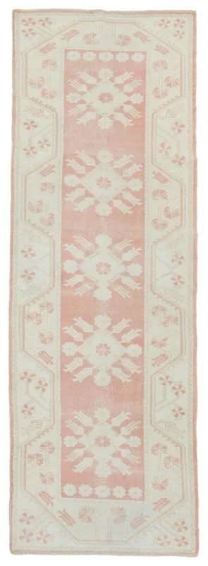 Full top view of the vintage Anatolian runner with rose field and ivory geometric patterns