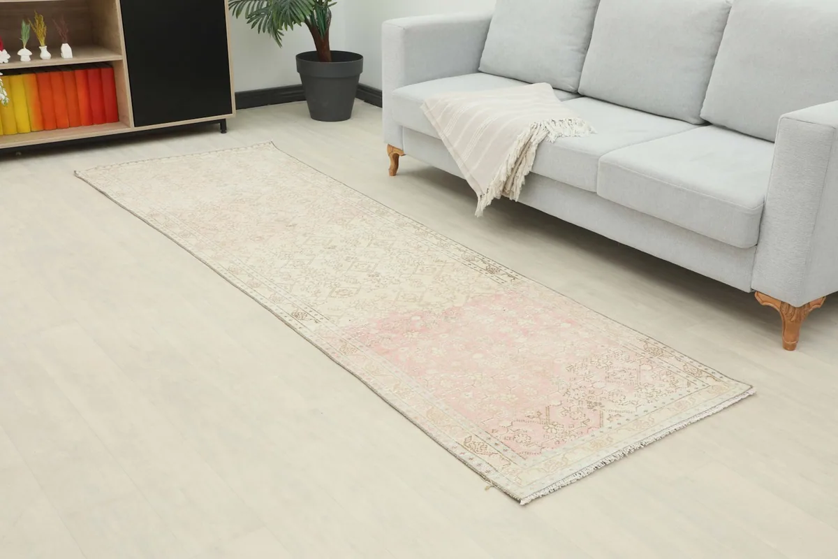 Angle view of the Anatolian runner rug extending along the floor in a contemporary room.