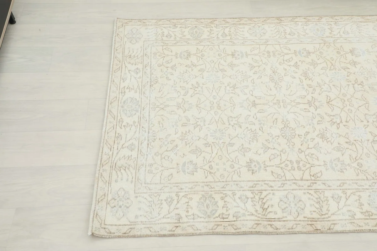 Another corner perspective of the hand-knotted rug, detailing the soft color variations