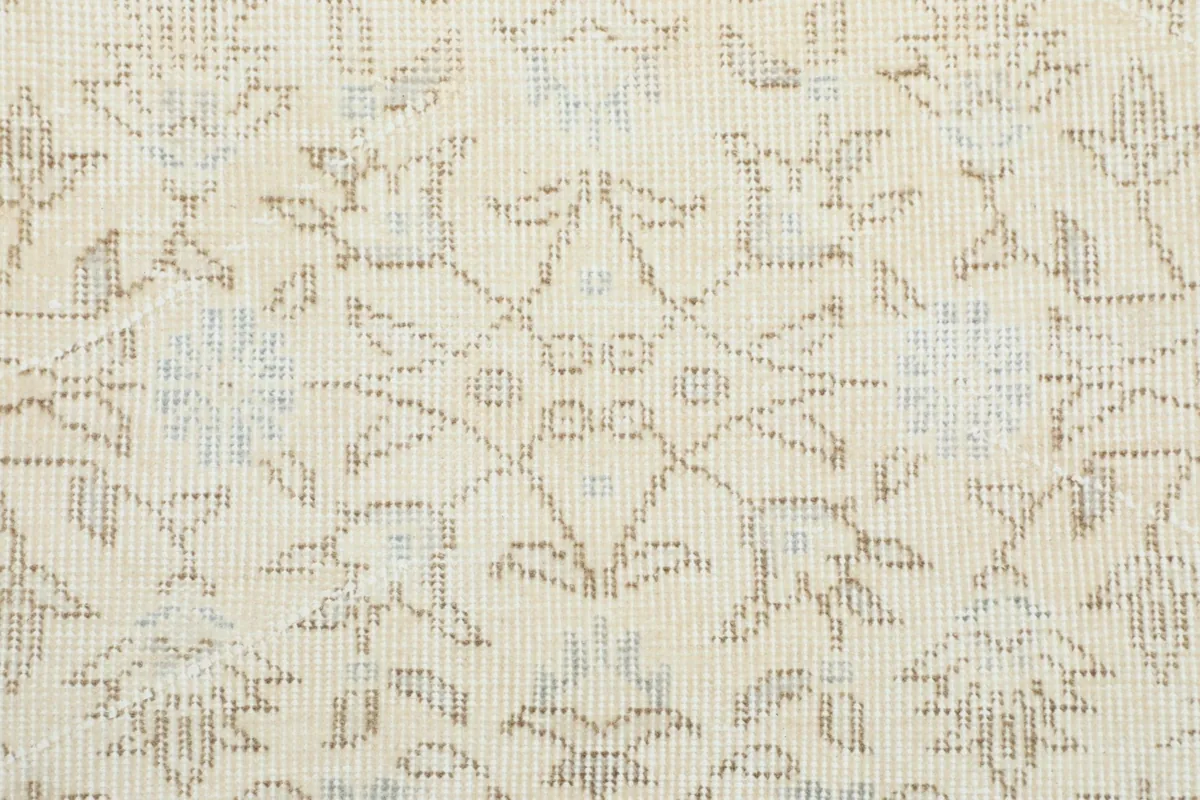 Detailed view of the rug's pile and intricate floral and geometric patterns