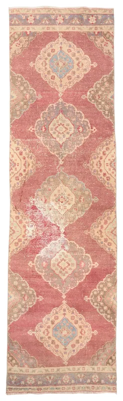 Full top view of the vintage Anatolian runner rug with rose and beige medallion patterns