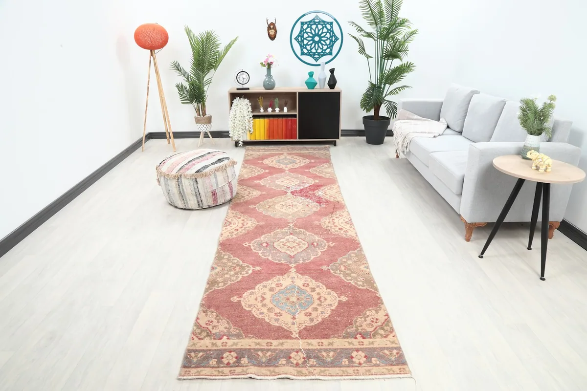 Runner rug placed in a modern living room setting, showing its full length and design