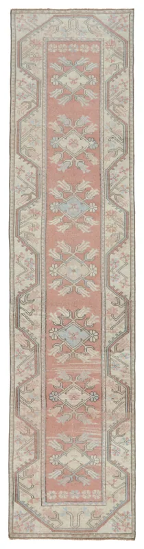 Full overhead view of the vintage rose geometric Anatolian runner on a white background