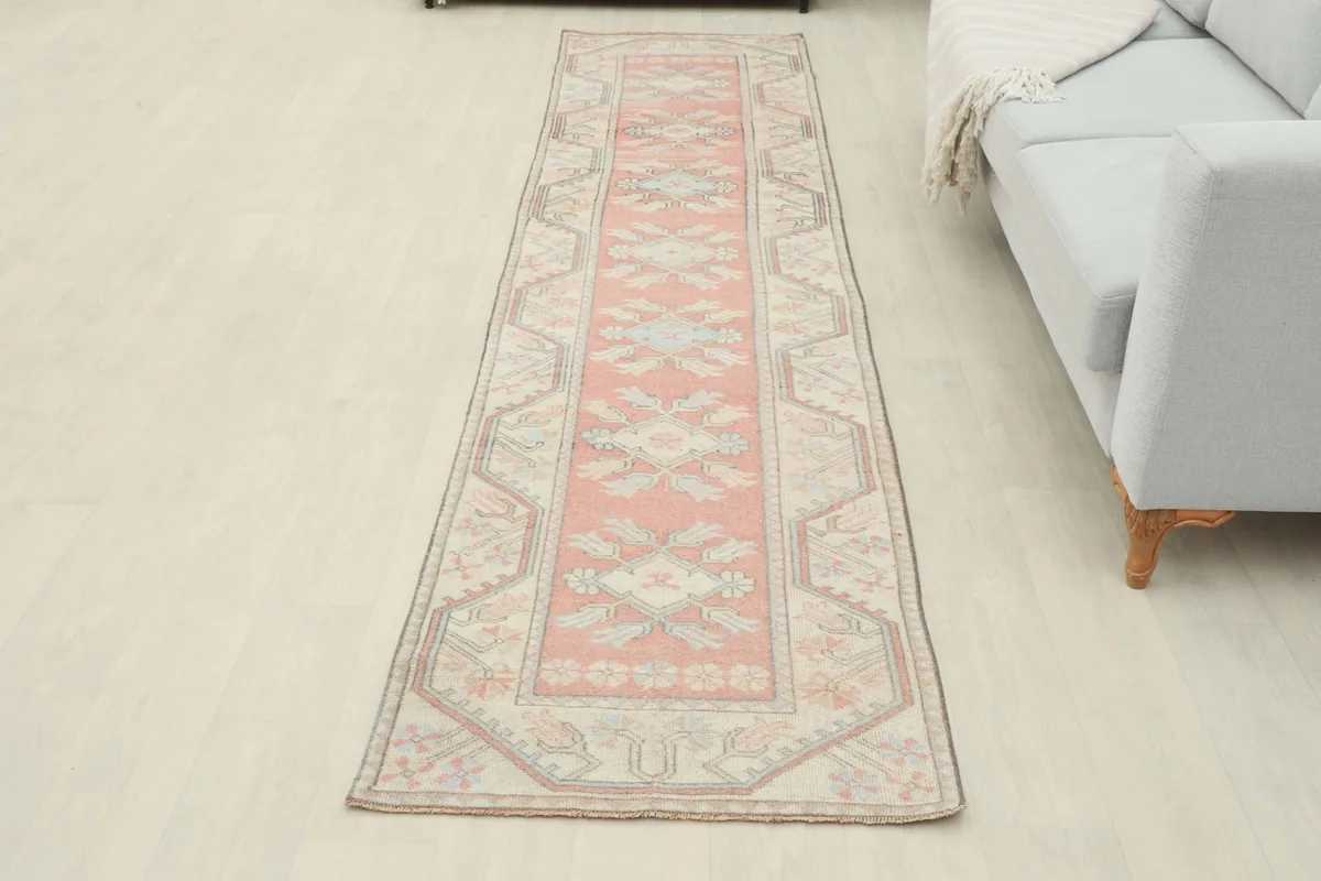 Full view of the rose runner laid out in a room, providing context for its size and color