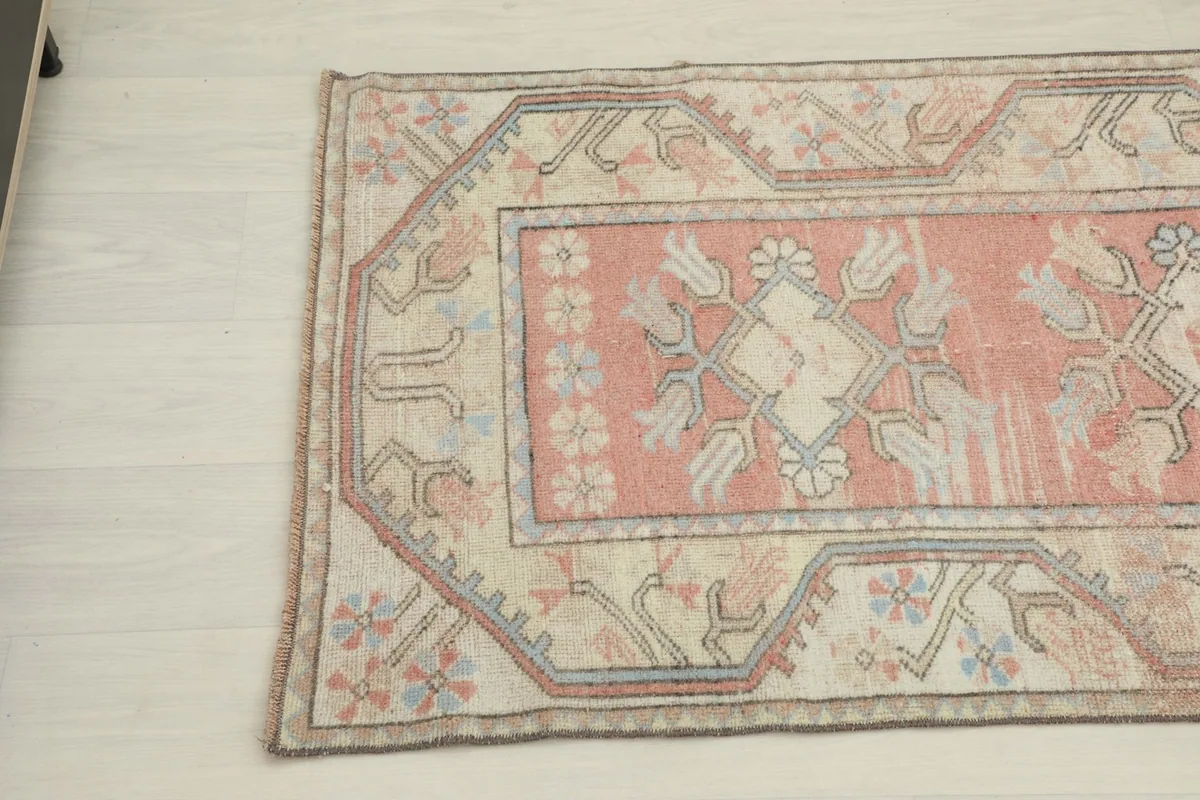 Close-up showing the other end of the runner with its geometric and floral motifs