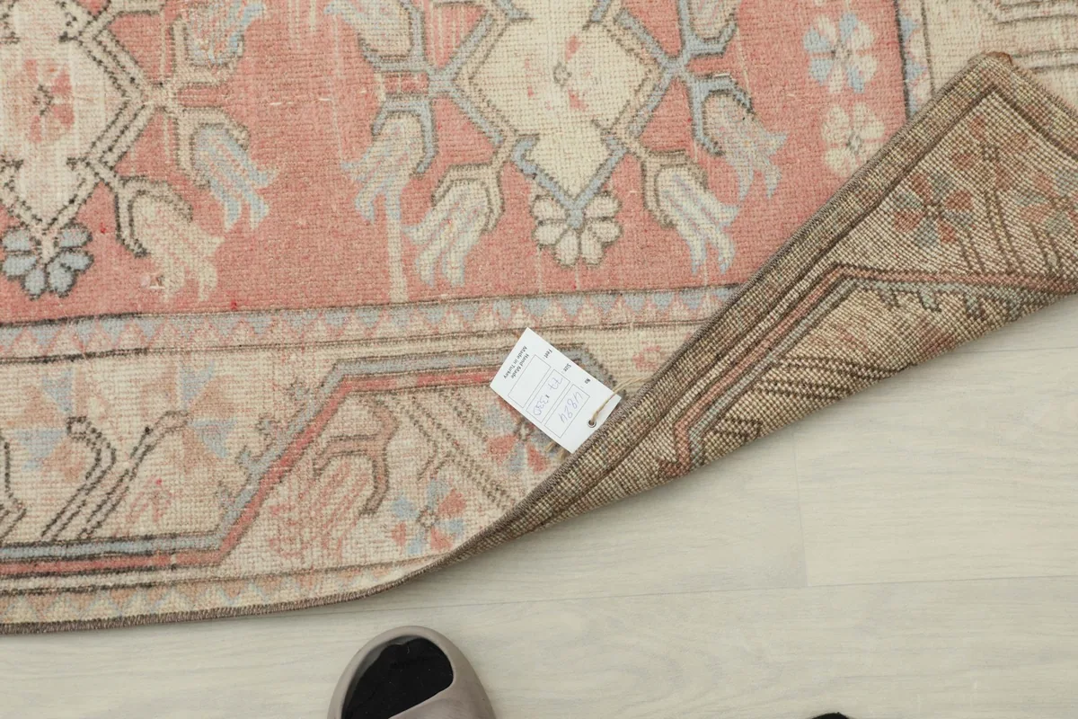Overhead view of the runner with a cleaning tag visible, showing its professionally cleaned status