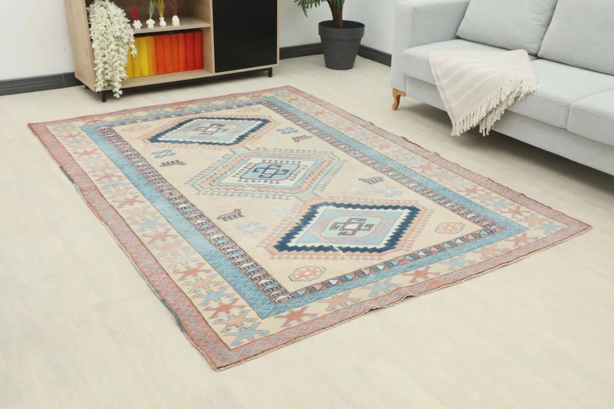 Angle view of the beige and blue rug laid out in a modern living space