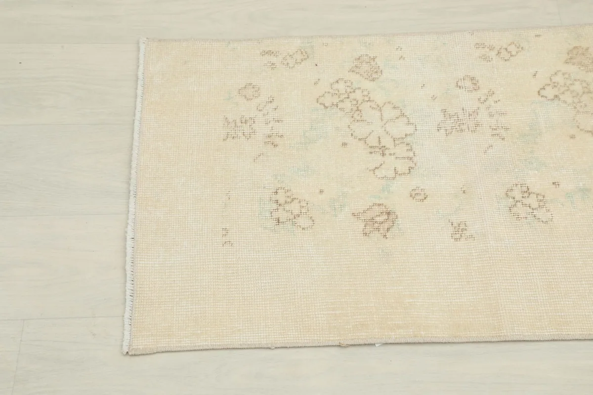 Detailed view of the rug's mid-section, showing the subtle color variations and hand-knotted texture.