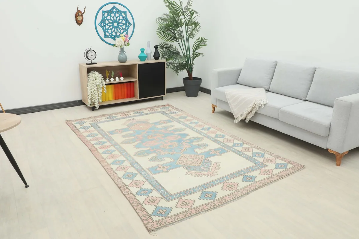 Anatolian rug in a modern living room setting with a light gray sofa
