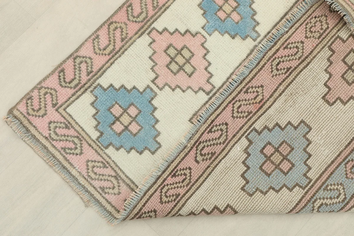 Close-up of the rug's reverse side, revealing the hand-knotted construction