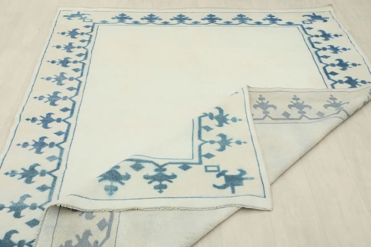 Another folded view of the rug, illustrating its pliable nature and craftsmanship