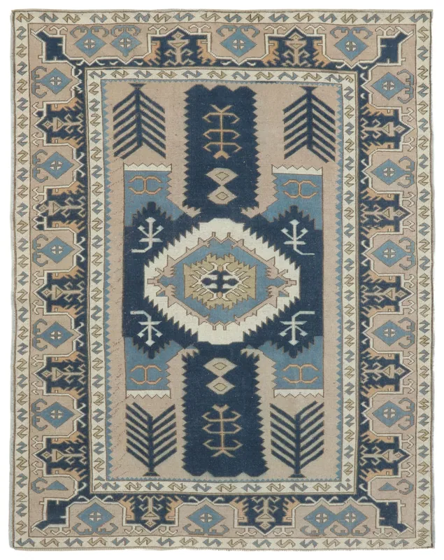 Full top view of the 5'7" x 7'3" vintage Anatolian rug with navy and beige colors