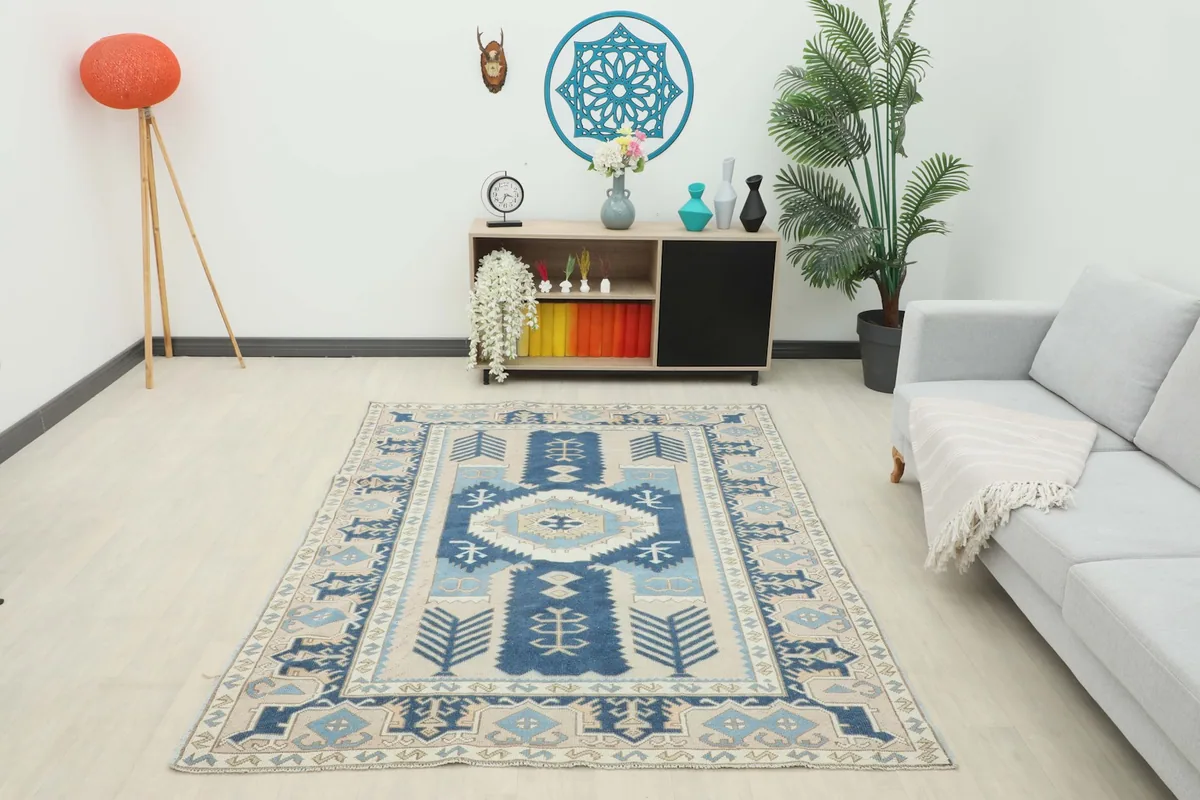 Full room view of the navy and beige vintage rug, showing its overall impact in a space