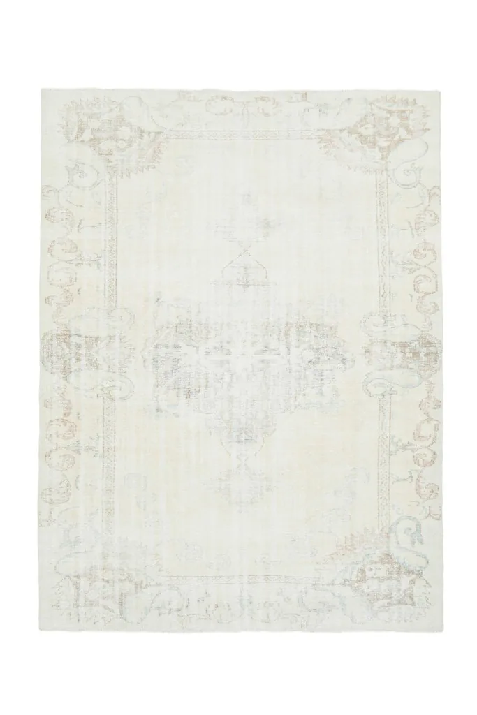 Full overhead view of the hand-knotted cream vintage rug, showcasing its complete design